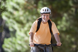 person riding a bike with a helmet on